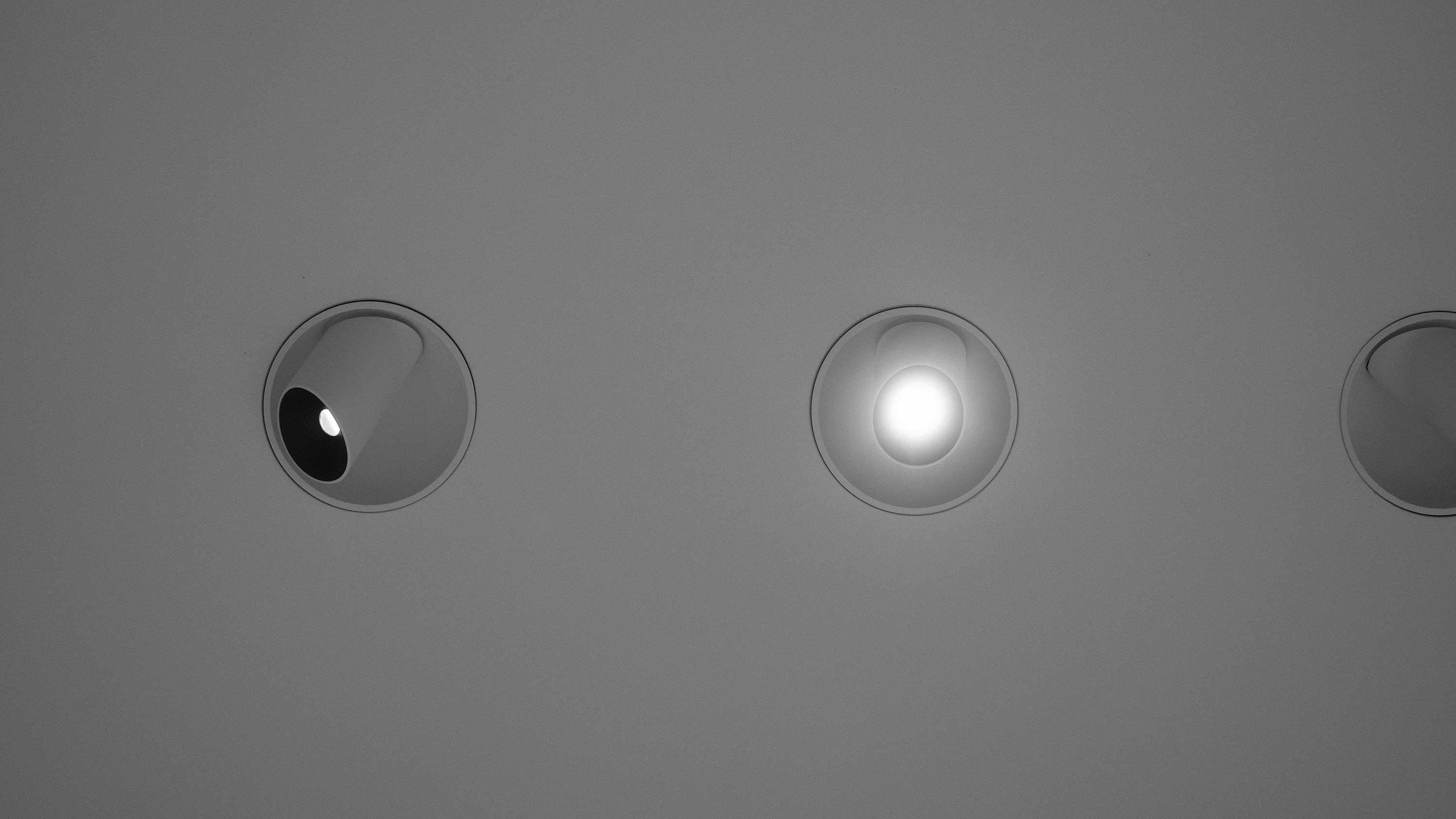 A ceiling with lamps and nice acoustic finishing
